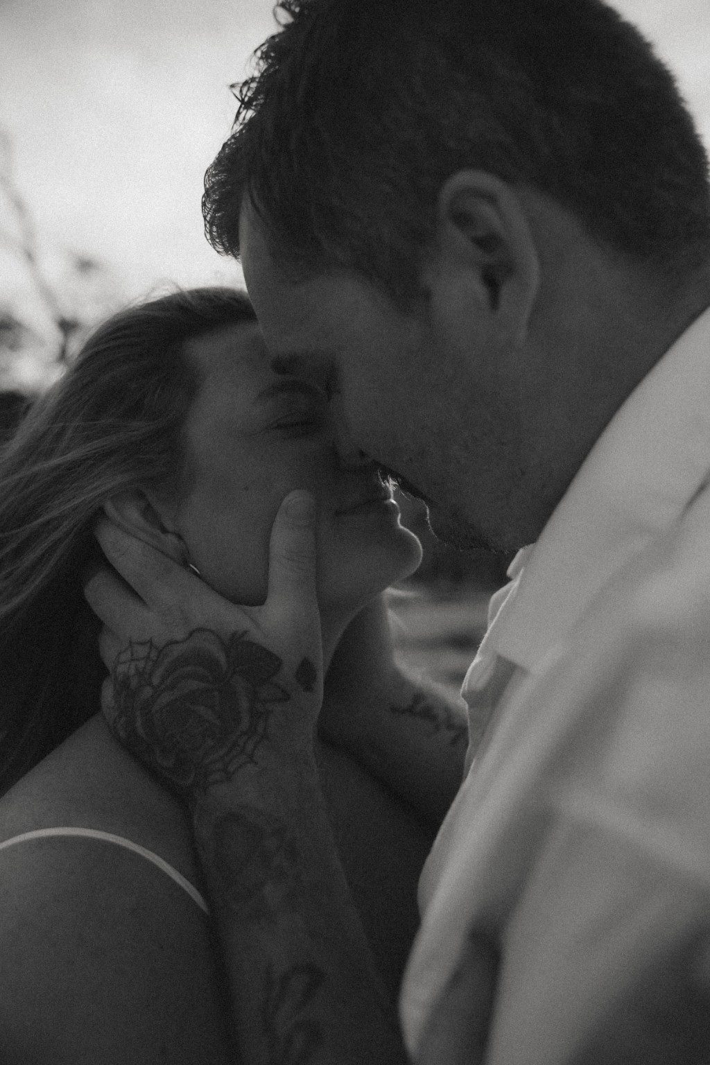 Black and white romantic closeup of Drake and Tori